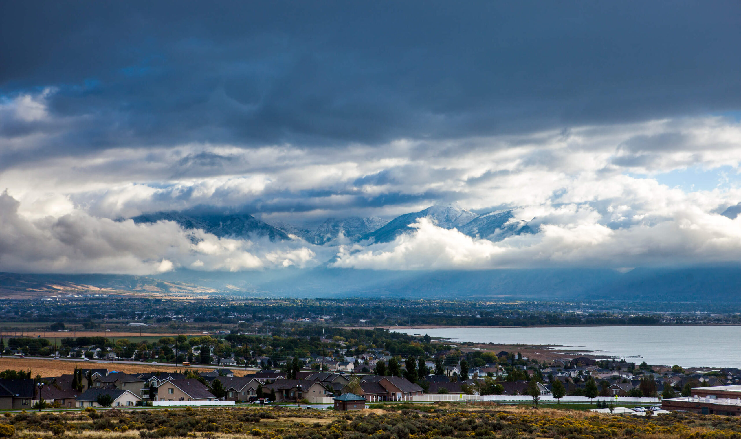 Aerial view of Lehi, Utah, with mountains in the distance. The disability lawyers at Barnes Disability Advocates help people in Lehi apply for Social Security Disability.