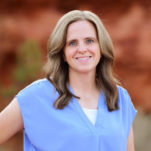 Lisa Blake, disability benefits payments manager at Barnes Disability Advocates, in front of red rocks in Utah.
